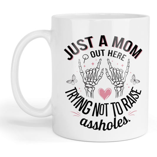 Just a mom out here trying not to raise assholes mug